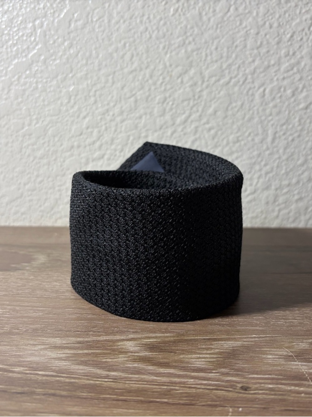 The Tie Bar Black Knit Tie with Green Logo Tag